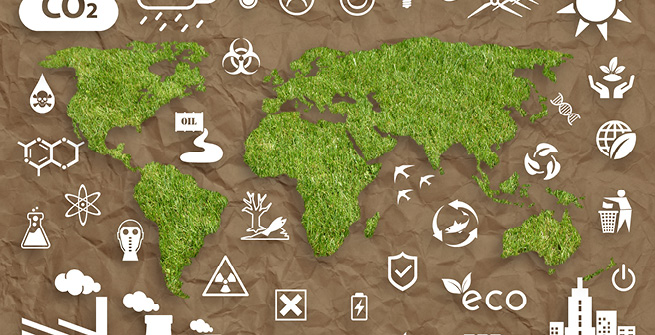 Weltkarte aus Gras mit Symbolen